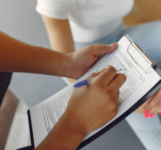 Physiotherapist guiding patient through personalized exercise prescription