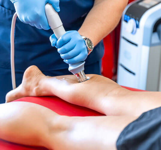 Patient receiving shockwave therapy treatment