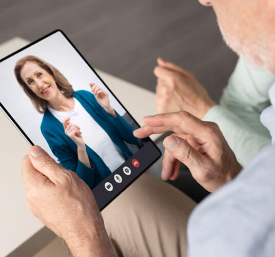 Virtual physiotherapy consultation session with a patient and therapist on a video call